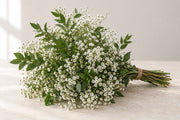 AI-assisted photo-style preview of Add Baby's Breath & Greens as shown; actual arrangement and proportions vary.