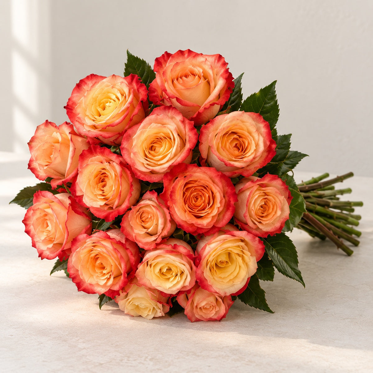 AI-assisted photo-style preview of 'Cabaret' Peach Two Tone Roses, 12-rose option; actual arrangement and proportions vary.