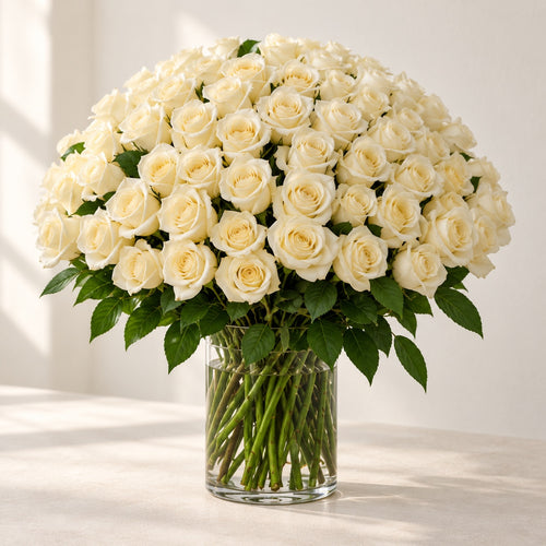 AI-assisted photo-style preview of 'Crem-de-la-Crem' Medium Stem Vase Arrangement, 100-rose option; actual arrangement and proportions vary.