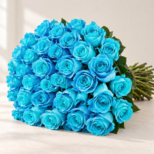 AI-assisted photo-style preview of 'Cyan' Blue Roses, 50-rose option; actual arrangement and proportions vary.