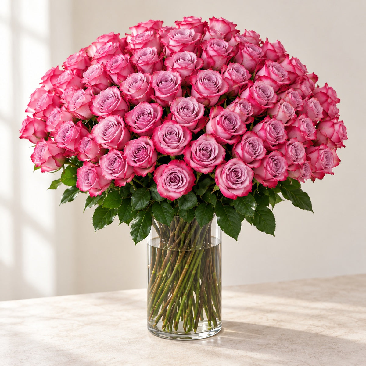AI-assisted photo-style preview of 'Deep Purple' Long Stem Vase Arrangement, 100-rose option; actual arrangement and proportions vary.