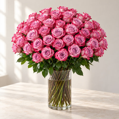 AI-assisted photo-style preview of 'Deep Purple' Long Stem Vase Arrangement, 50-rose option; actual arrangement and proportions vary.