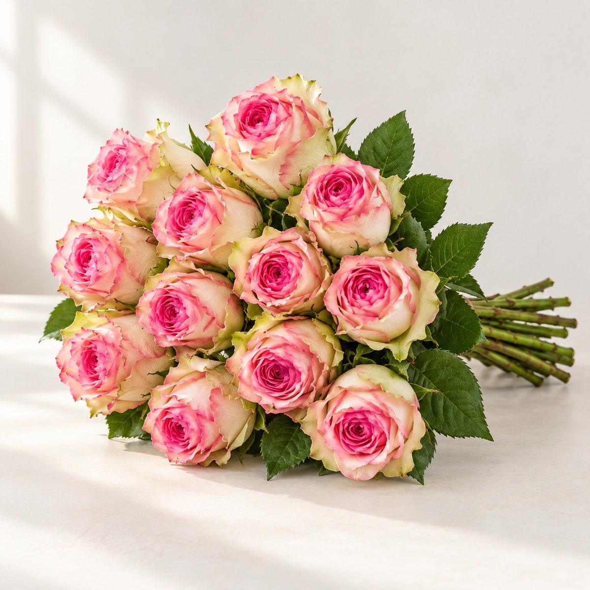 AI-assisted photo-style preview of 'Esperanza' Two Tone Pink Roses, 12-rose option; actual arrangement and proportions vary.