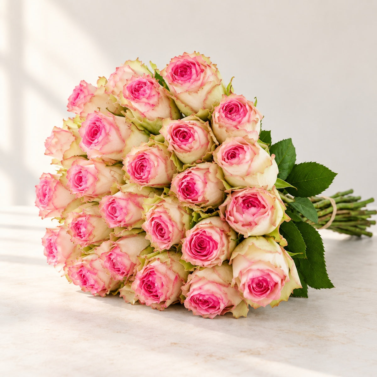 AI-assisted photo-style preview of 'Esperanza' Two Tone Pink Roses, 25-rose option; actual arrangement and proportions vary.