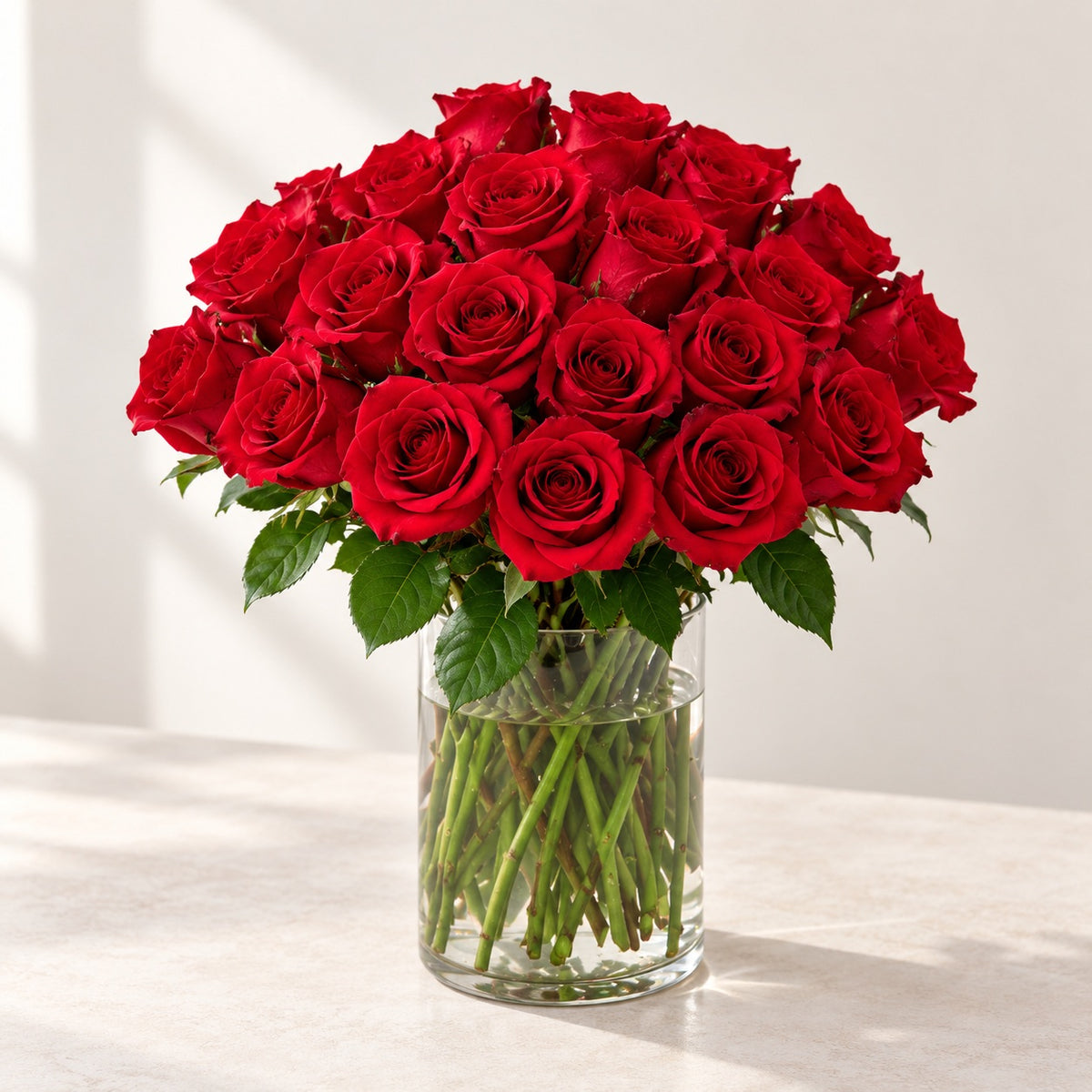 AI-assisted photo-style preview of 'Explorer' Medium Stem Vase Arrangement, 25-rose option; actual arrangement and proportions vary.