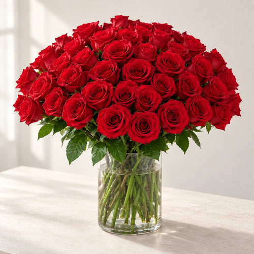 AI-assisted photo-style preview of 'Explorer' Medium Stem Vase Arrangement, 50-rose option; actual arrangement and proportions vary.