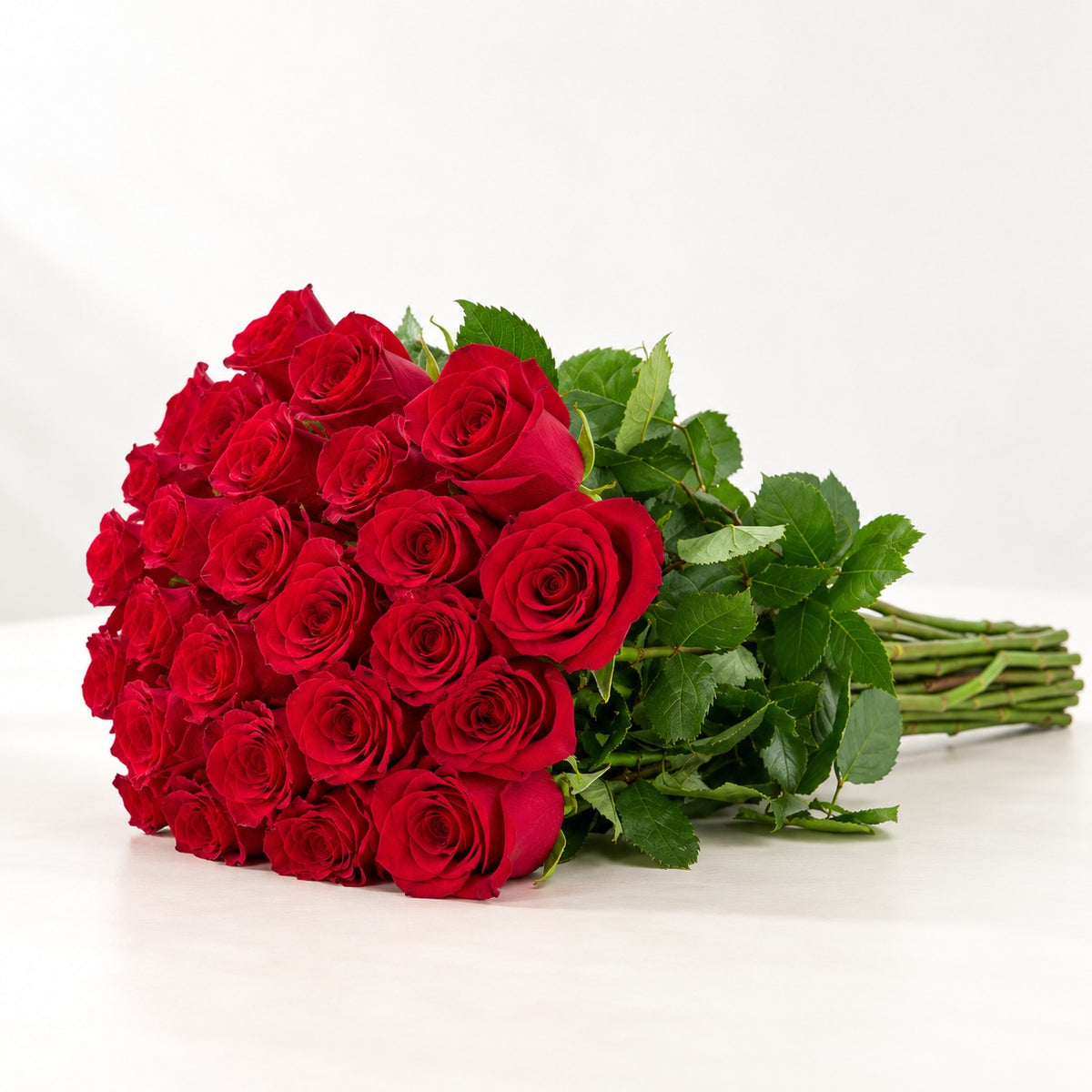AI-assisted photo-style preview of 'Explorer' Red Roses, 25-rose option; actual arrangement and proportions vary.