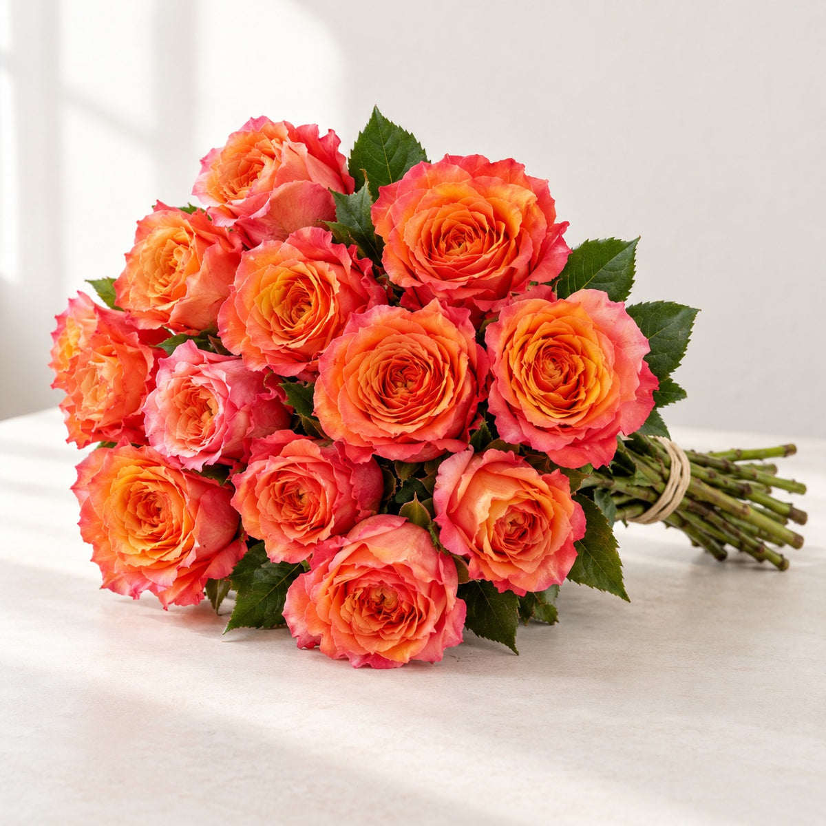 AI-assisted photo-style preview of 'Free-Spirit' Orange Garden Roses, 12-rose option; actual arrangement and proportions vary.