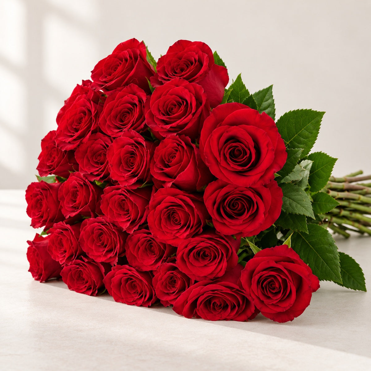 AI-assisted photo-style preview of 'Freedom' Red Rose, 25-rose option; actual arrangement and proportions vary.