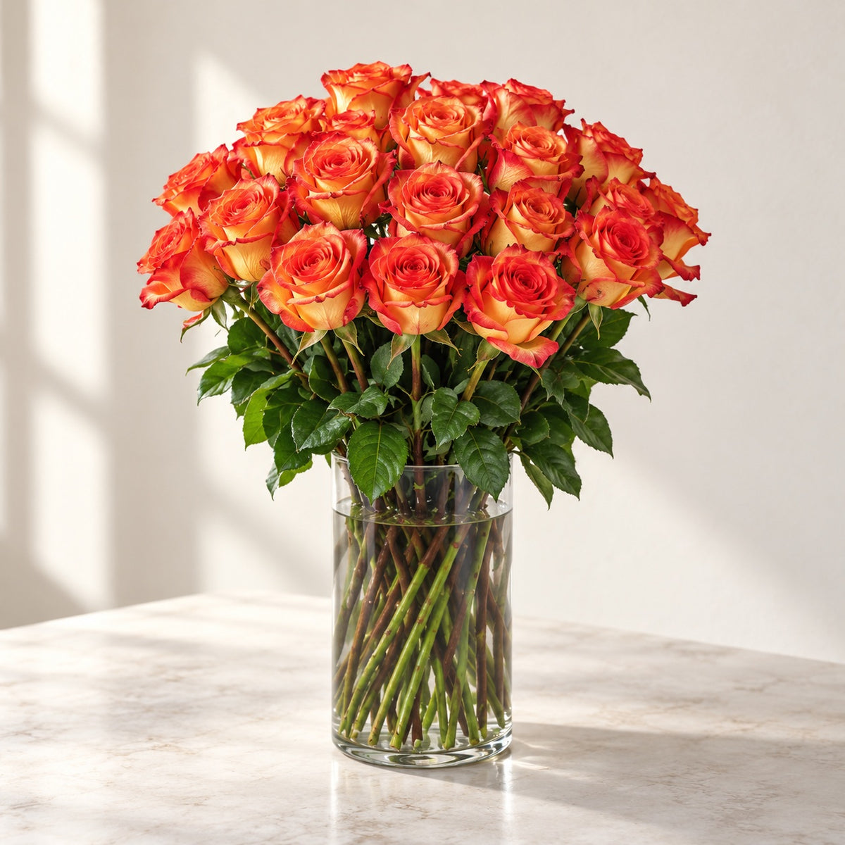 AI-assisted photo-style preview of 'High & Orange' Long Stem Vase Arrangement, 25-rose option; actual arrangement and proportions vary.