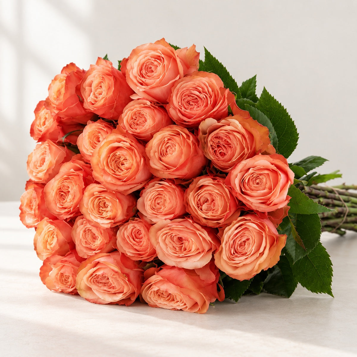 AI-assisted photo-style preview of 'Kahala' Peach Roses, 25-rose option; actual arrangement and proportions vary.