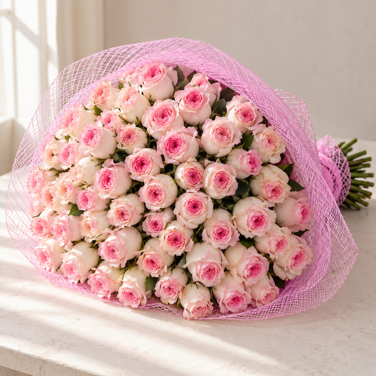 Photo-style illustrative preview for 101 soft pink Mandala roses in classic pink mesh; actual blooms and proportions vary.