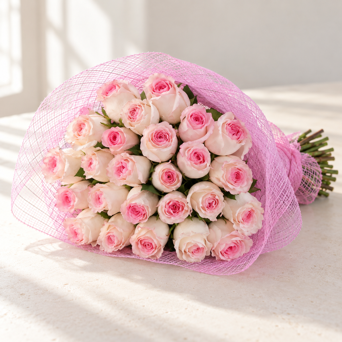 Photo-style illustrative preview for 25 soft pink Mandala roses in classic pink mesh; actual blooms and proportions vary.