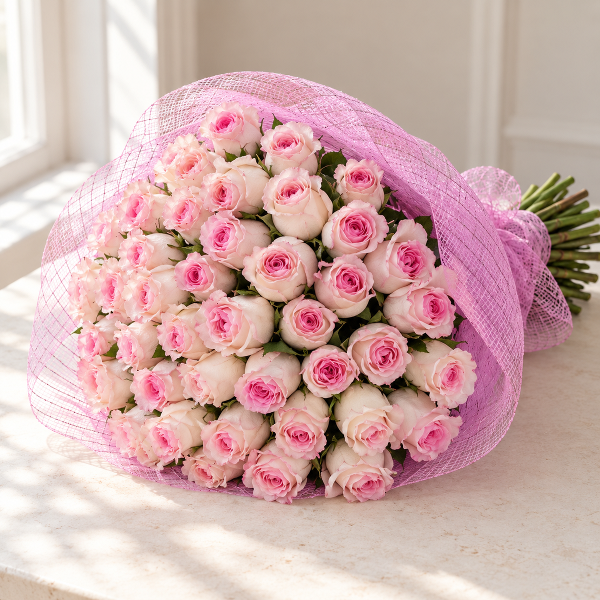 Photo-style illustrative preview for 75 soft pink Mandala roses in classic pink mesh; actual blooms and proportions vary.