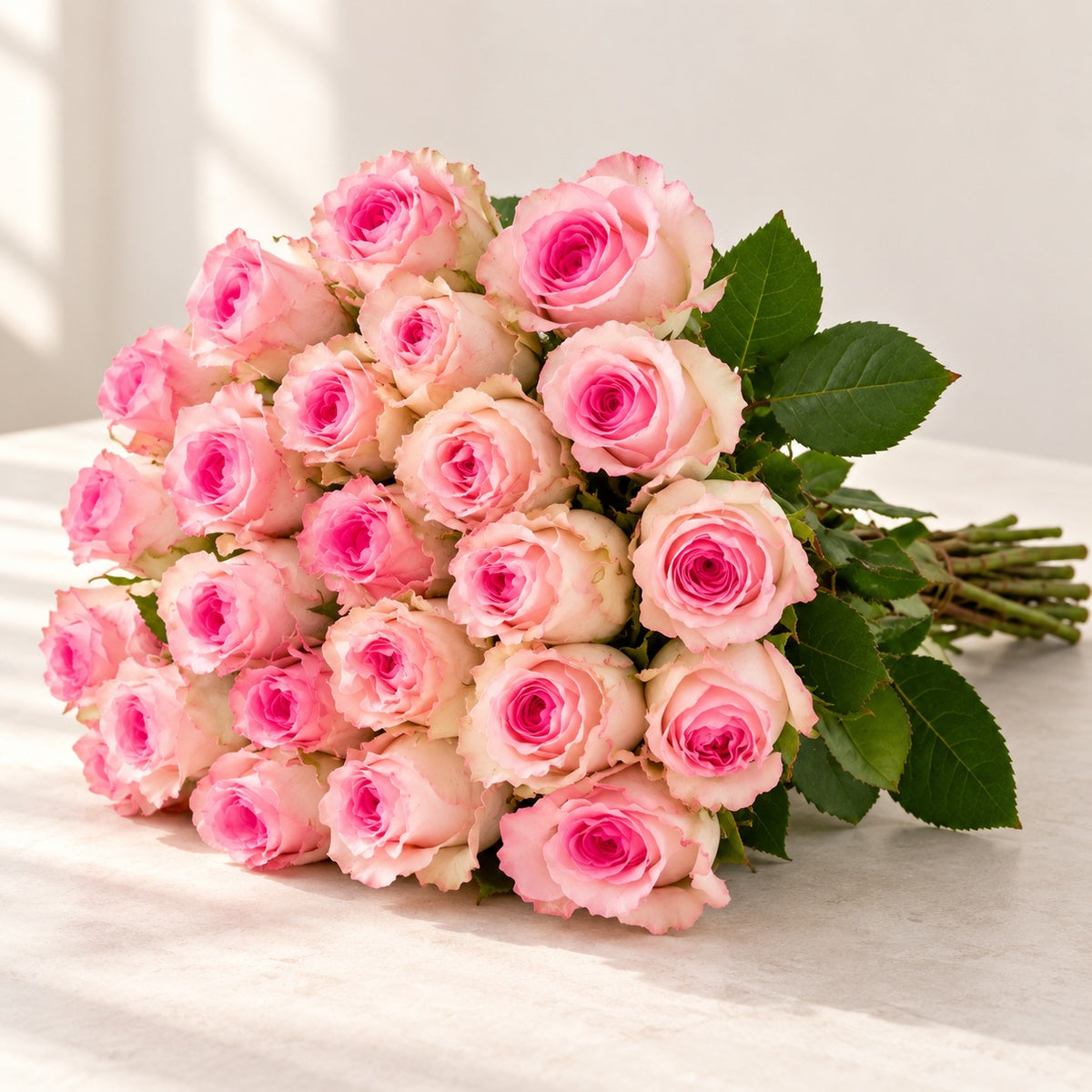 AI-assisted photo-style preview of 'Mandala' Soft Pink Roses, 25-rose option; actual arrangement and proportions vary.