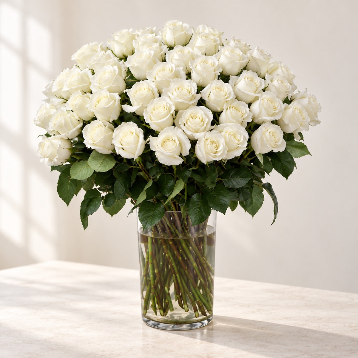 AI-assisted photo-style preview of 'MIA' XLong Stem Vase Arrangement, 50-rose option; actual arrangement and proportions vary.