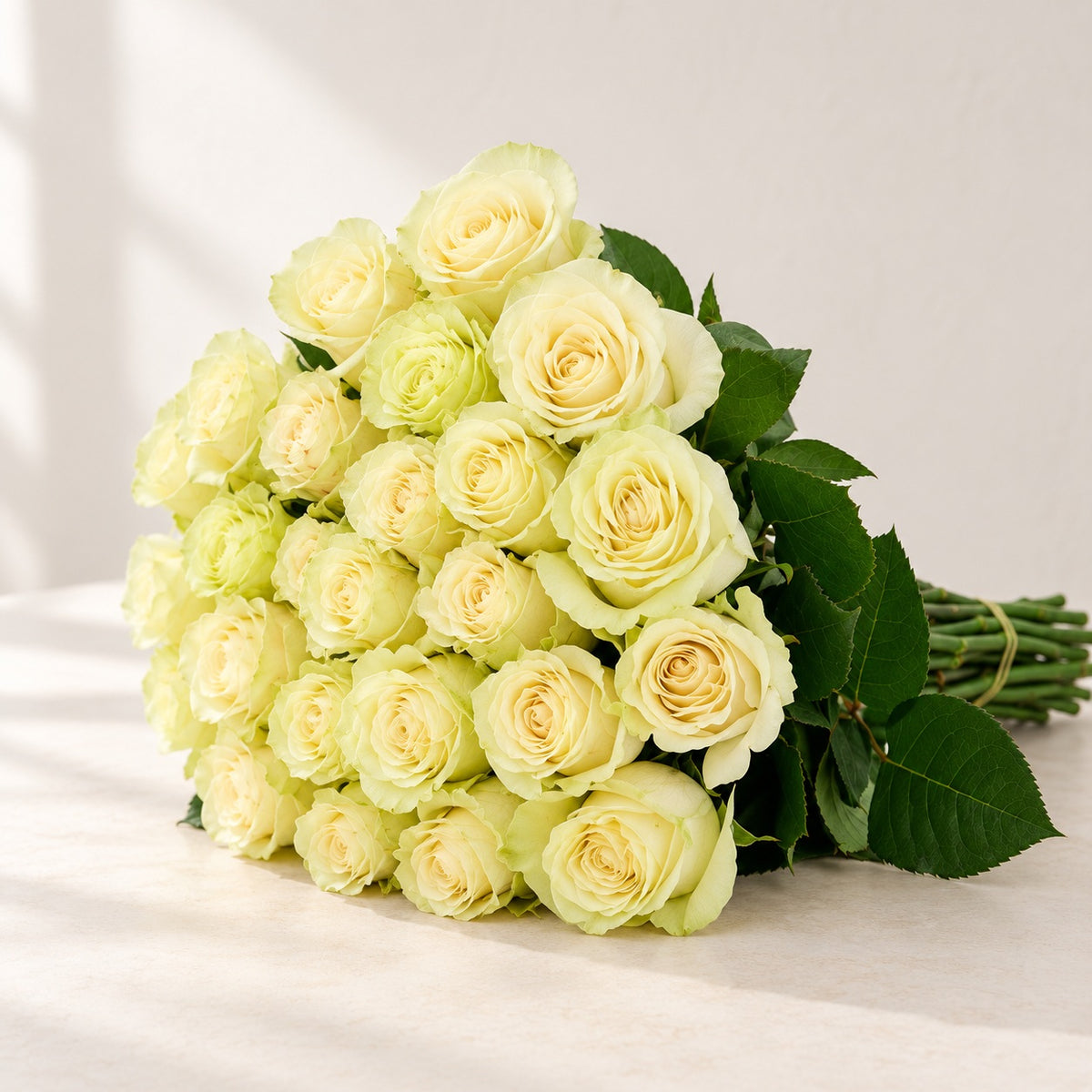 AI-assisted photo-style preview of 'Mondial' Off White Roses, 25-rose option; actual arrangement and proportions vary.