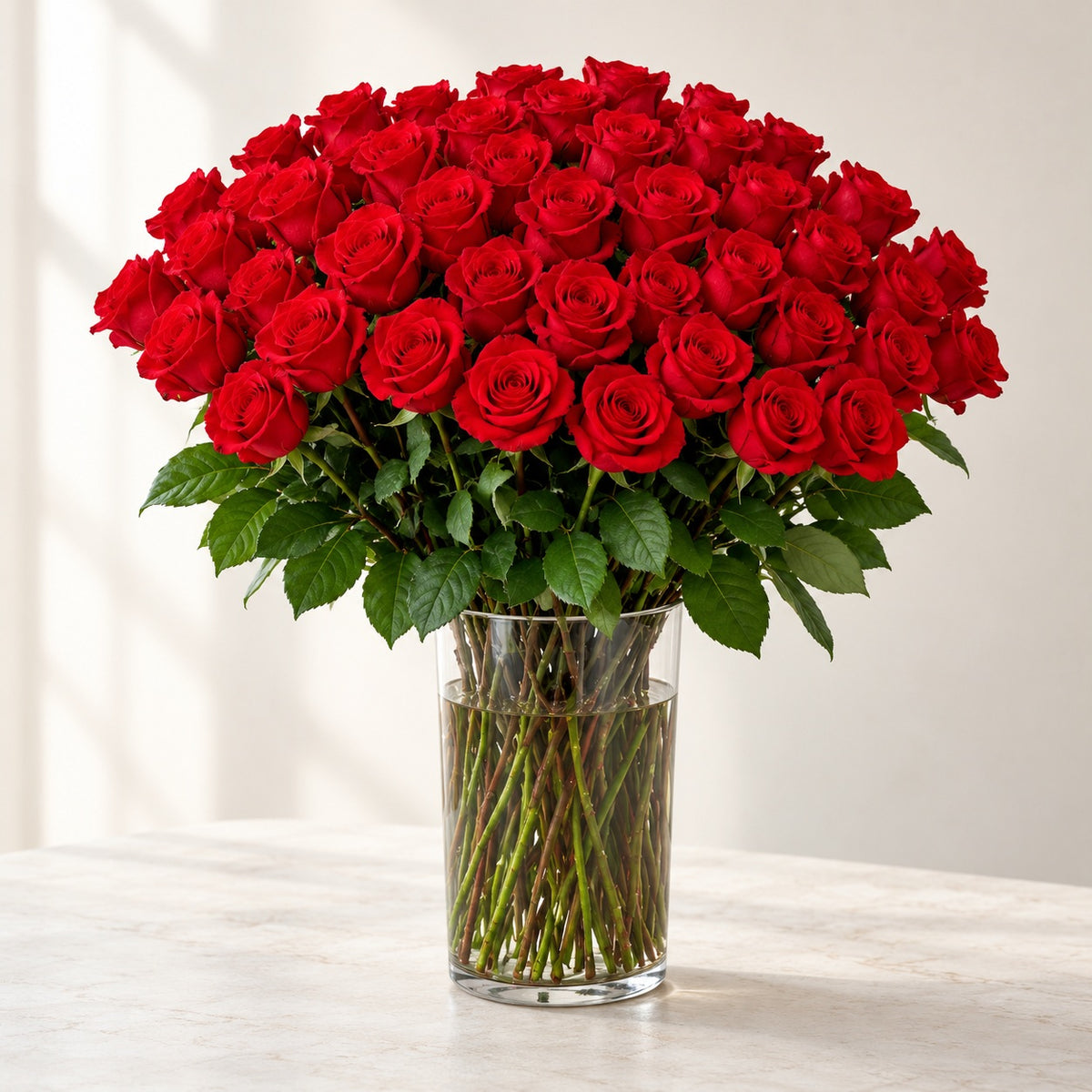 AI-assisted photo-style preview of 'Nina' XLong Stem Vase Arrangement, 50-rose option; actual arrangement and proportions vary.