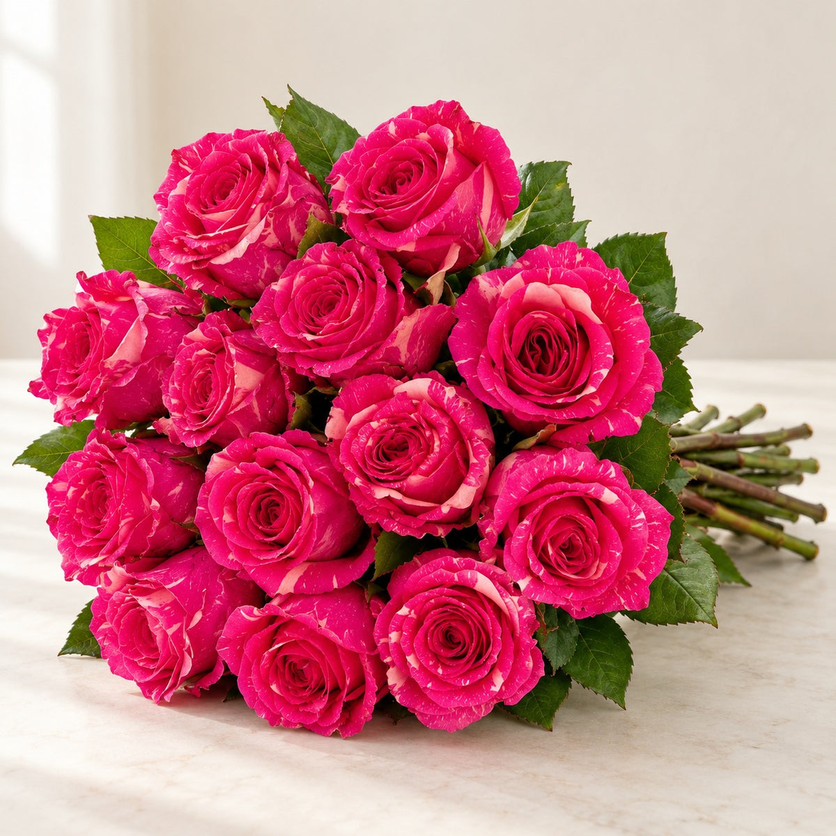 AI-assisted photo-style preview of 'Pandora' Pink Marble Roses, 12-rose option; actual arrangement and proportions vary.