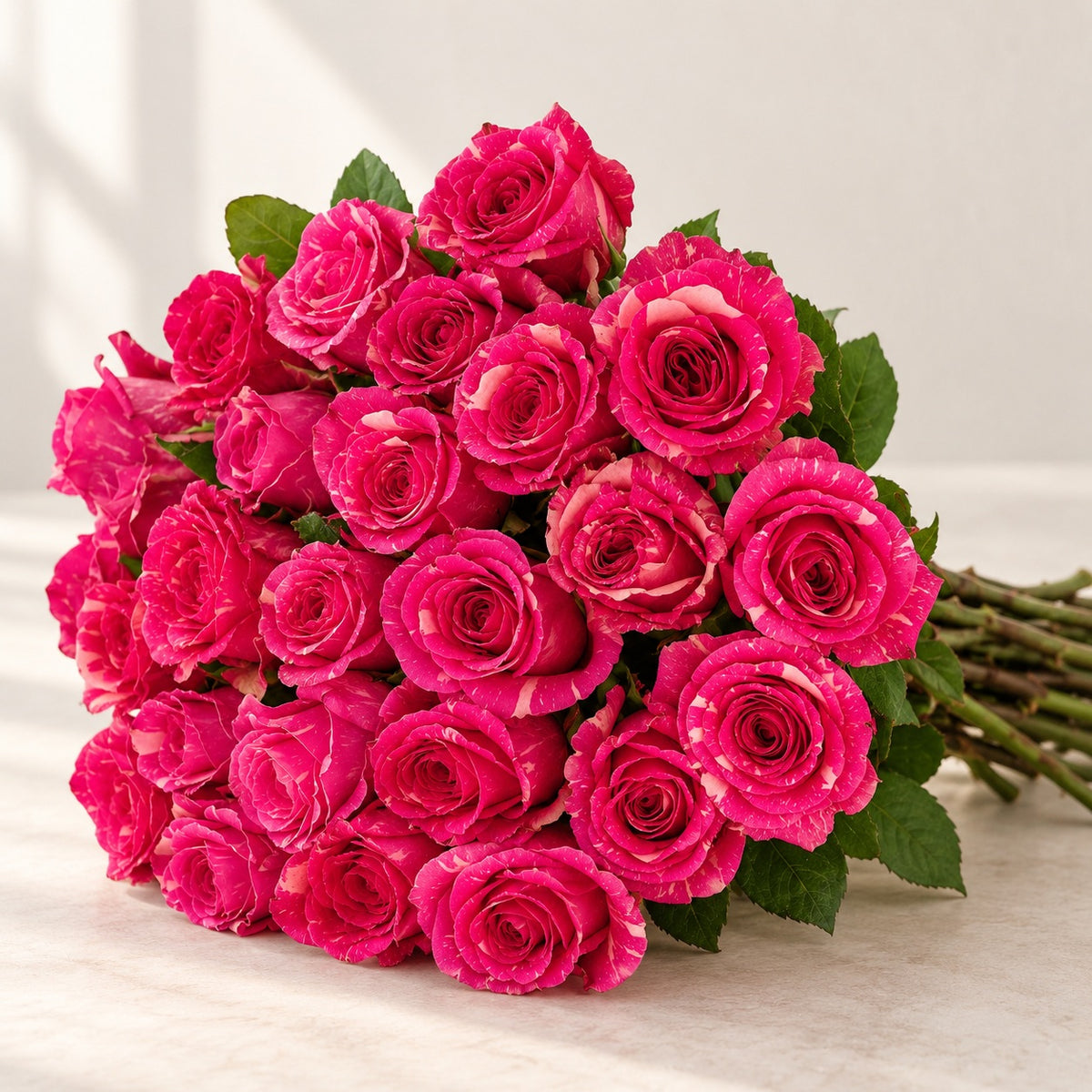 AI-assisted photo-style preview of 'Pandora' Pink Marble Roses, 25-rose option; actual arrangement and proportions vary.