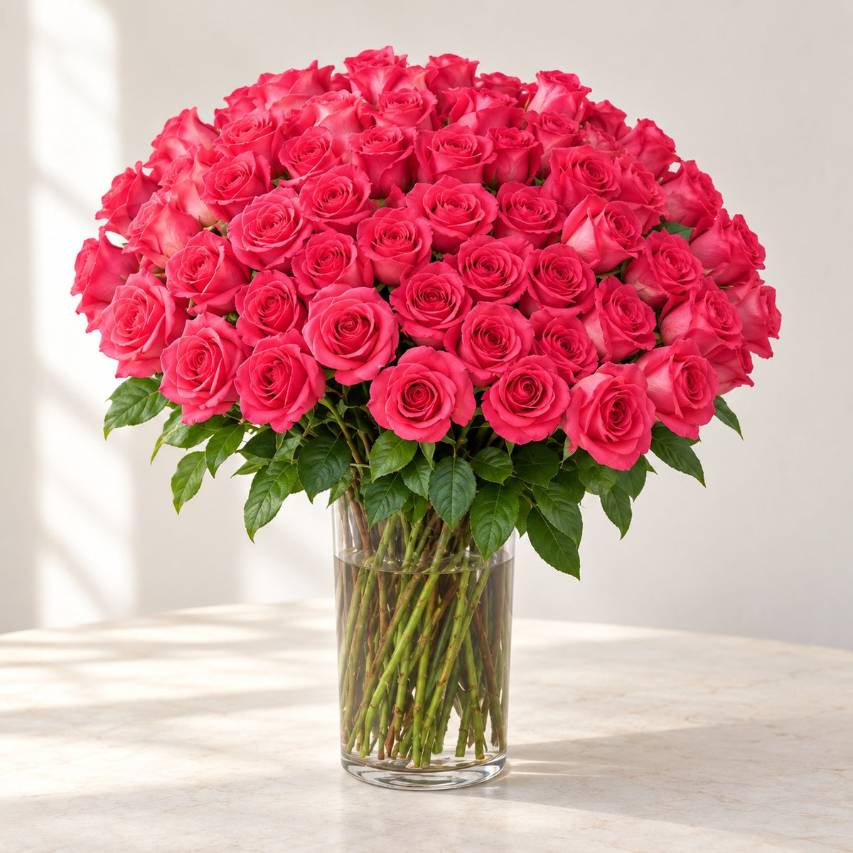 AI-assisted photo-style preview of 'Pink Floyd' XLong Stem Vase Arrangement, 75-rose option; actual arrangement and proportions vary.