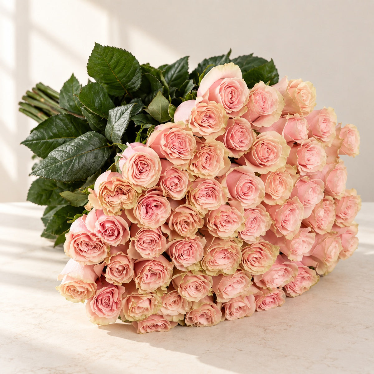 AI-assisted photo-style preview of 'Pink Mondial' Signature Fifty Rose Bouquet as shown; actual arrangement and proportions vary.