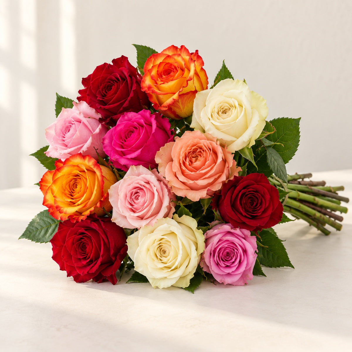 AI-assisted photo-style preview of 'Rainbow' Mixed Color Roses, 12-rose option; actual arrangement and proportions vary.