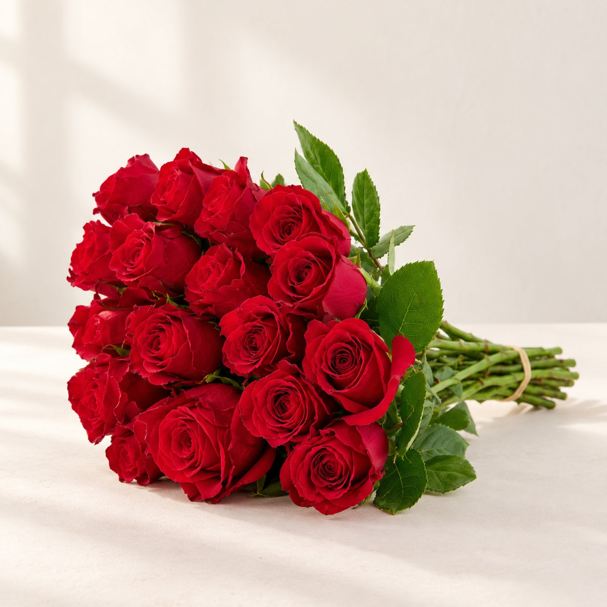 AI-assisted photo-style preview of 'Sexy Red' Roses, 12-rose option; actual arrangement and proportions vary.