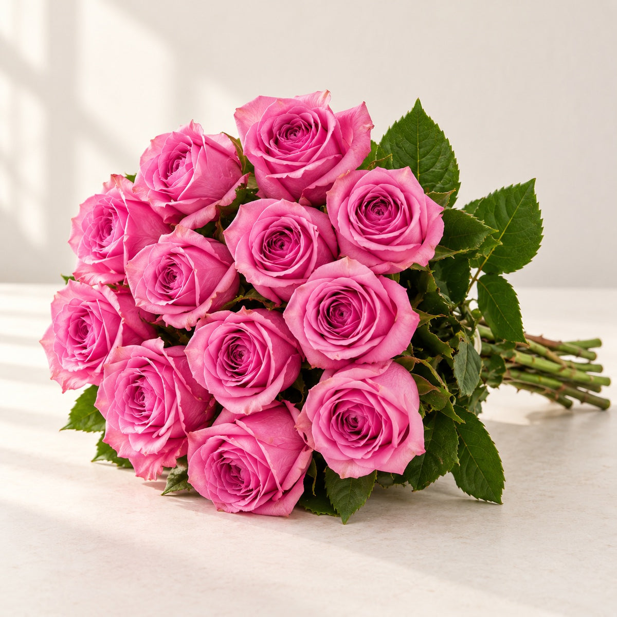 AI-assisted photo-style preview of 'Soulmate' Pink Roses, 12-rose option; actual arrangement and proportions vary.