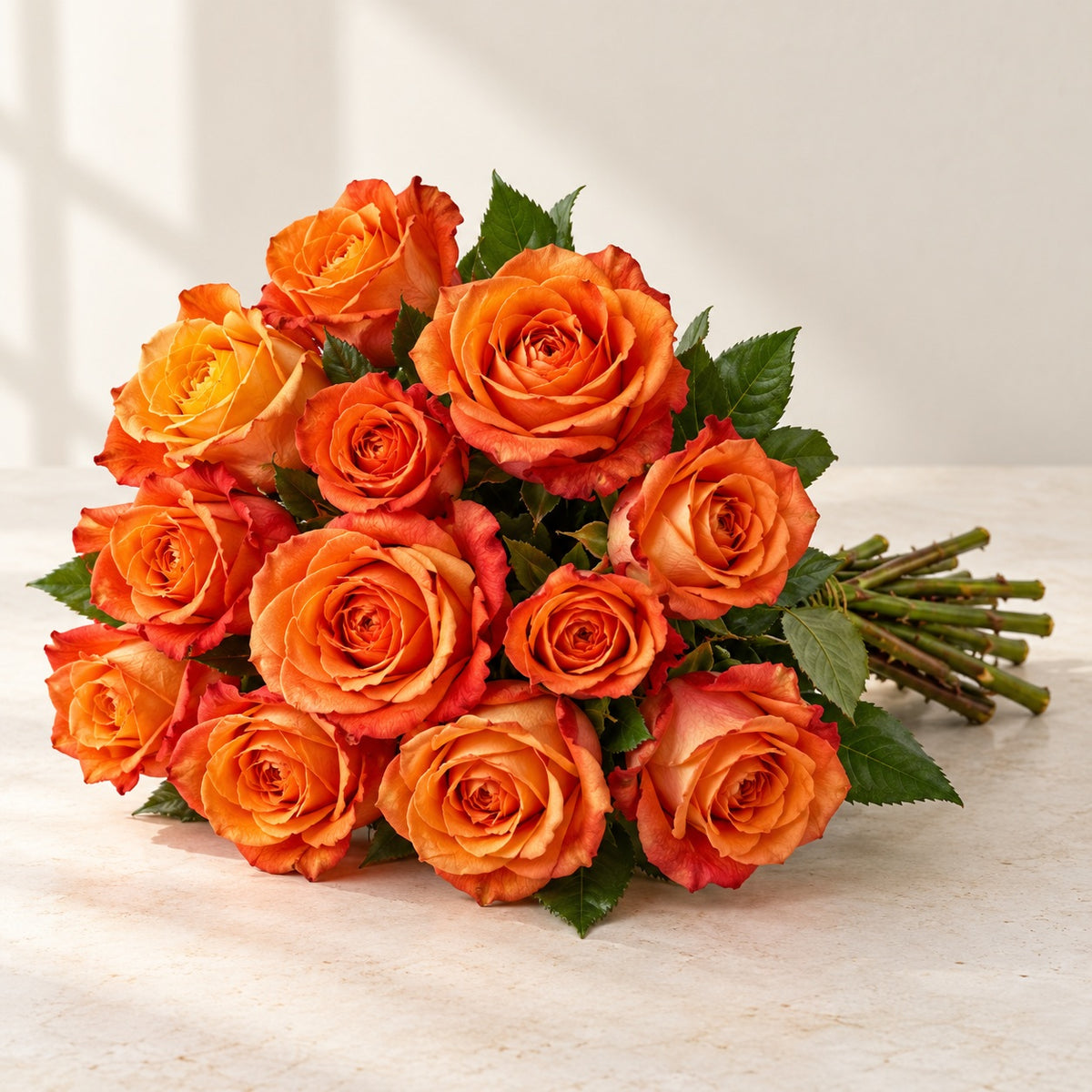 AI-assisted photo-style preview of 'Sunset Glory' Orange Roses, 12-rose option; actual arrangement and proportions vary.