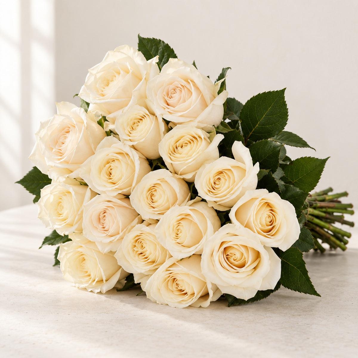 AI-assisted photo-style preview of 'Vendela' Off-White Roses, 12-rose option; actual arrangement and proportions vary.