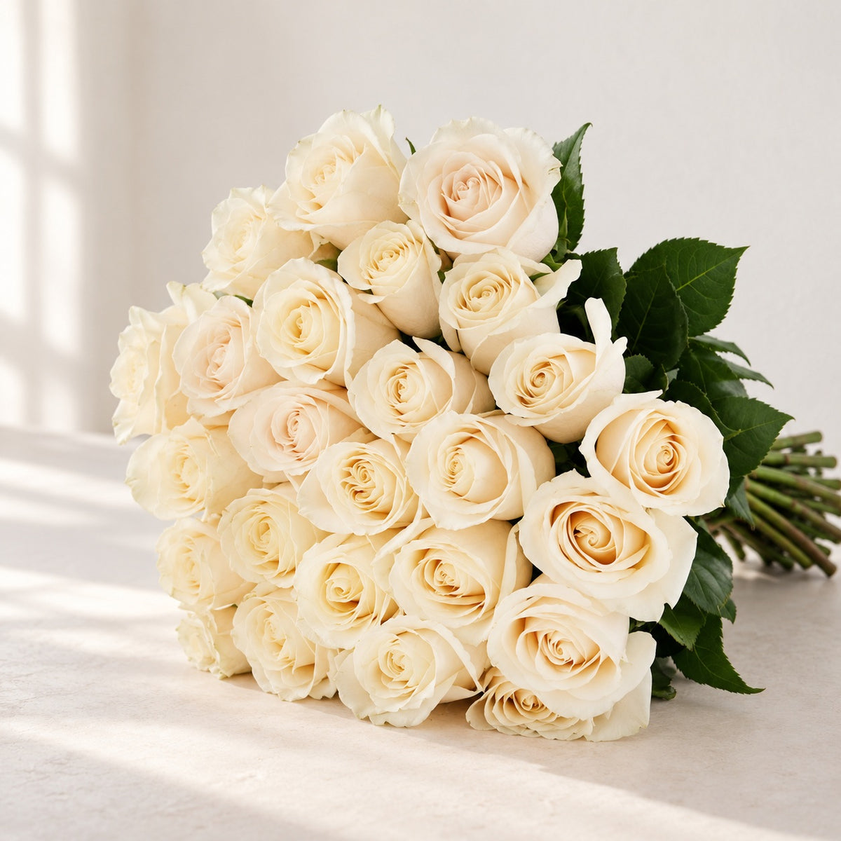 AI-assisted photo-style preview of 'Vendela' Off-White Roses, 25-rose option; actual arrangement and proportions vary.